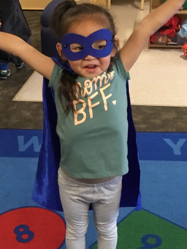 an image of child in a superheroes uniform