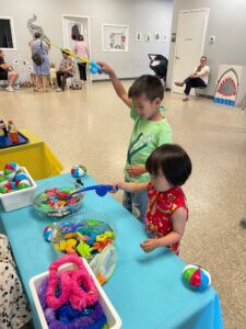 children playing inside at summer activity fishing for toys at cadence academy preschool 453 pond
