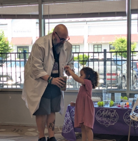 child participating in magic trick at cadence academy preschool 454 eliot