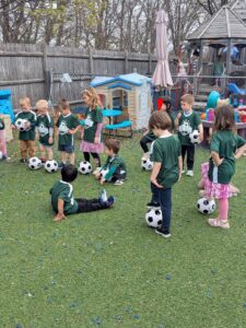 children playing soccer after school at cadence academy preschool 454 eliot