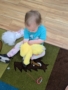 child stuffing stuffed animal at cadence academy preschool 454 eliot