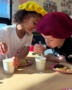 Children engaging in hands on activity at little big minds uptown