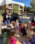 Children learning outside with teacher engaged at Little Big Minds Uptown