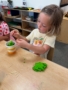 female child engaging in hands on learning at little big minds uptown