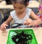 Child learning through hands on activity play at Little Big Minds Kennedy