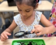 Child learning through hands on activity play at Little Big Minds Kennedy
