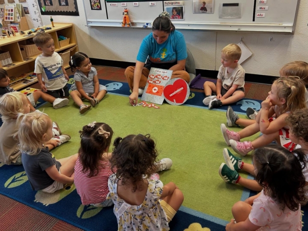 Children learning with assistance from teacher at Little Big Minds Kennedy