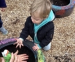 child playing outside in dirt in bucket preschool and daycare newton school for children 455
