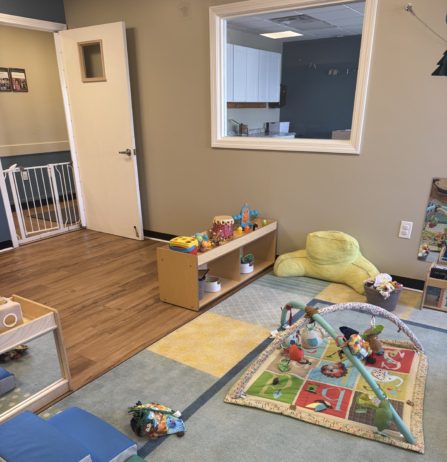 Inside Cadence Academy Preschool small cubbies with learning materials in brightly lit classroom