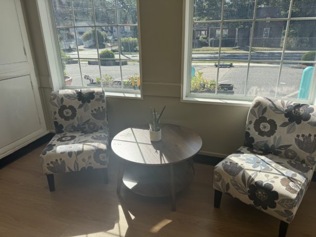 Lobby of Cadence Academy Preschool in Natick 2 chairs next to launch windows with sun shining through