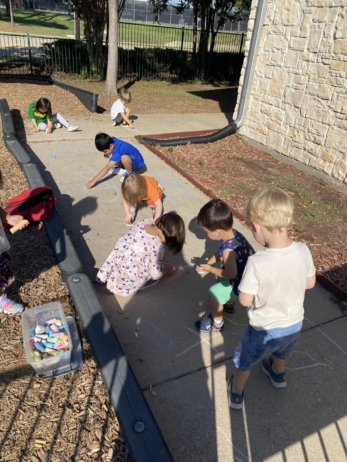 Outside with Chalk at preschool and daycare at 335 Peter's Colony