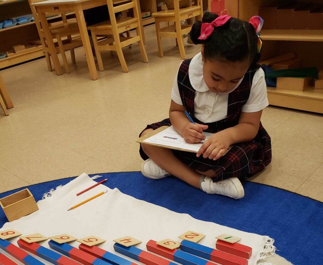 child writing number at preschool and daycare at 339 Virginia Parkway