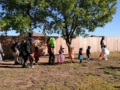 A photo of children walking on grass in halloween costumes outside of preschool and daycare Hebron 336