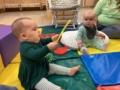 infant playing on carpet at preschool and daycare at 335 Peter's Colony