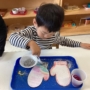 kid painting mittens at preschool and daycare at 335 Peter's Colony