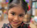 a child smiling inside