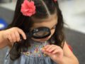 a child using a magnifying glass