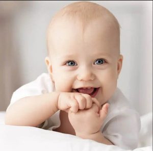 an infant smiling