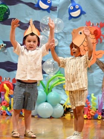 two male children performing at little big minds chandler