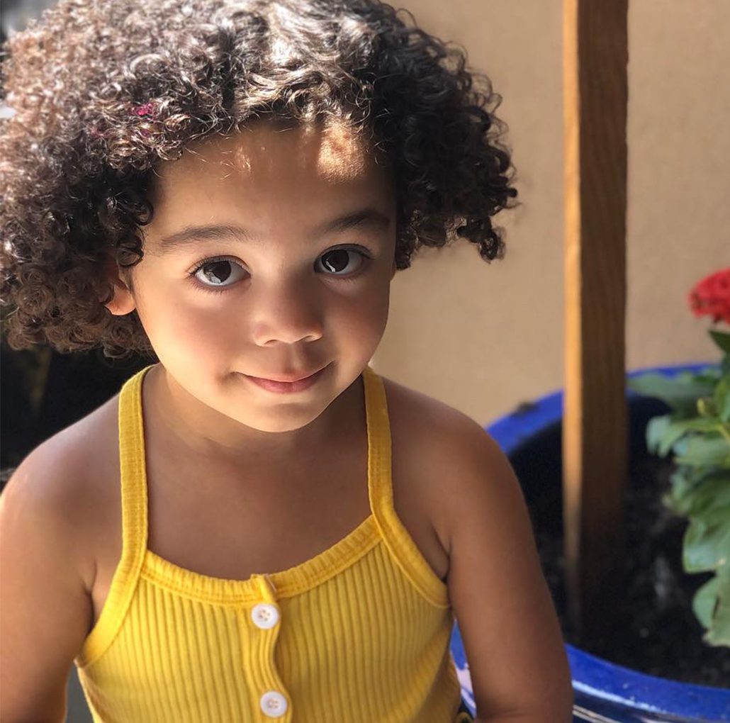 A child smiling outside