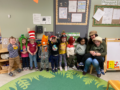 a group of a children posing for a photo indoors