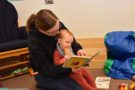 a teacher reading to a child