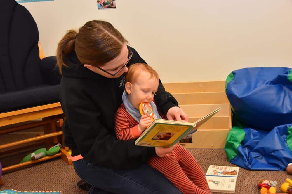 a teacher reading to a child