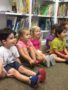 a group of children learning indoors