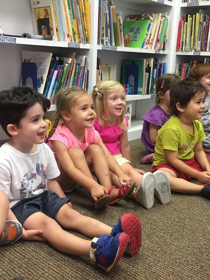 a group of children learning indoors