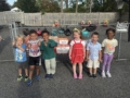 children smiling together collecting donations at cadence academy preschool 450 whitman washington