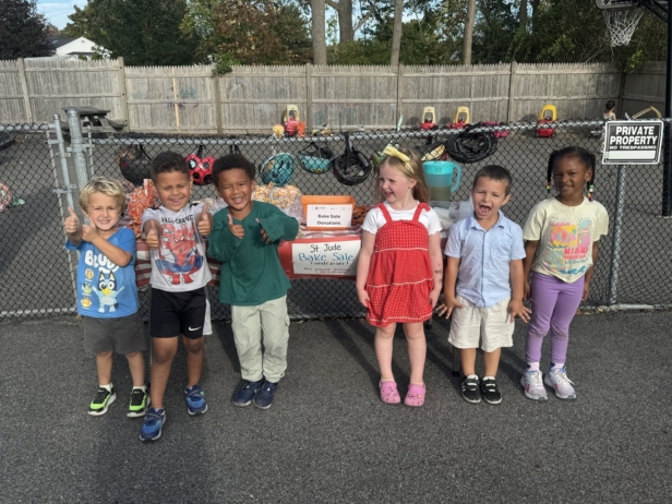 children smiling together collecting donations at cadence academy preschool 450 whitman washington