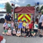 children smiling with firefighters learning at preschool and daycare at cadence academy preschool 450 whitman washington