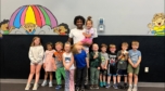 children posing with summer camp teacher at cadence academy preschool and daycare west o 510