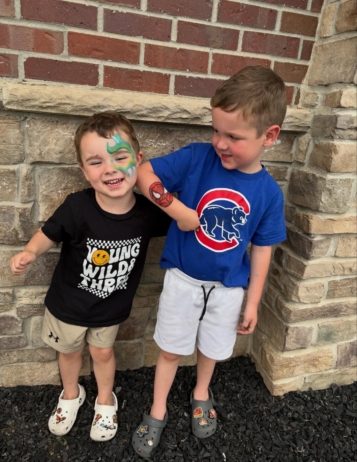 Children smiling together with face paint at the professors learning center daycare and preschool elkhorn NE 509
