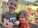 Children smiling together outside in playground at the professors learning center daycare and preschool elkhorn NE 509