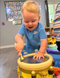 child playing with drum at the professors learning center daycare and preschool elkhorn NE 509
