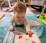 Infant spreading paint around a plastic bag learning about sensory at the professors learning center daycare and preschool elkhorn NE 509