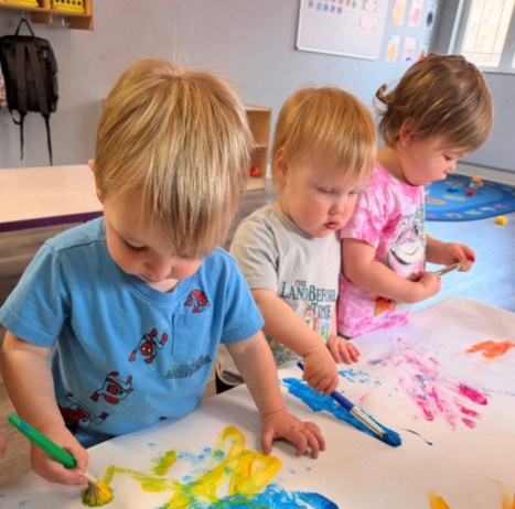 children painting on paper in classroom with colors at the professors learning center daycare and preschool elkhorn NE 509