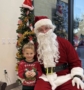 child posing with santa at watch me grow power