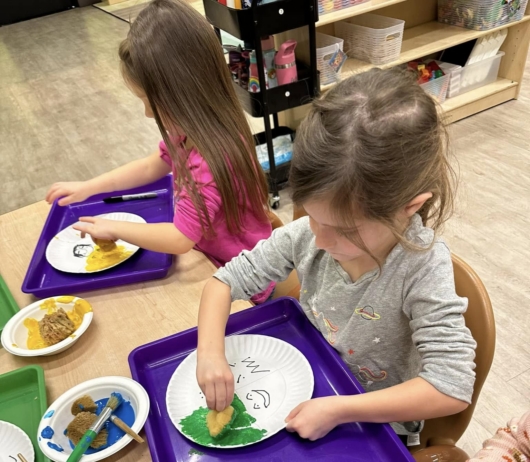 female children learning through hands on activity at watch me grow riggs