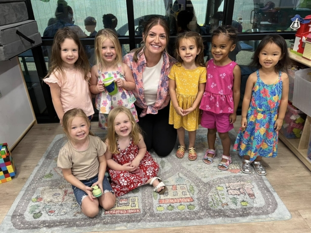 group photo of chilren with teacher at watch me grow riggs