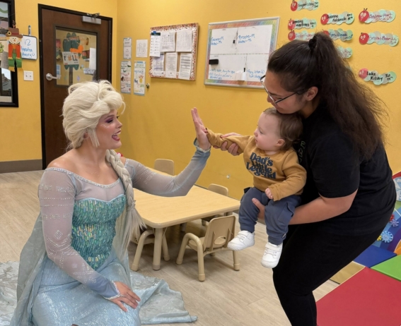 infant high fiving elsa at watch me grow germann