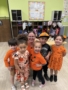 male and female children posing with teacher at watch me grow power