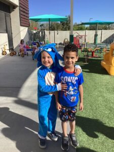 two male children posing smiling at watch me grow riggs