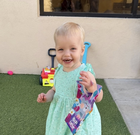 young child smiling outside at watch me grow germann