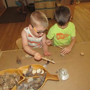 young children working together on a hands-on classroom activity at natural choice academy