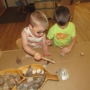 young children working together on a hands-on classroom activity at natural choice academy