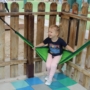 young child enjoying a hammock in the outdoor classroom at natural choice academy
