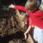 preschool child exploring natural outdoor learning area at natural choice academy by cadence education