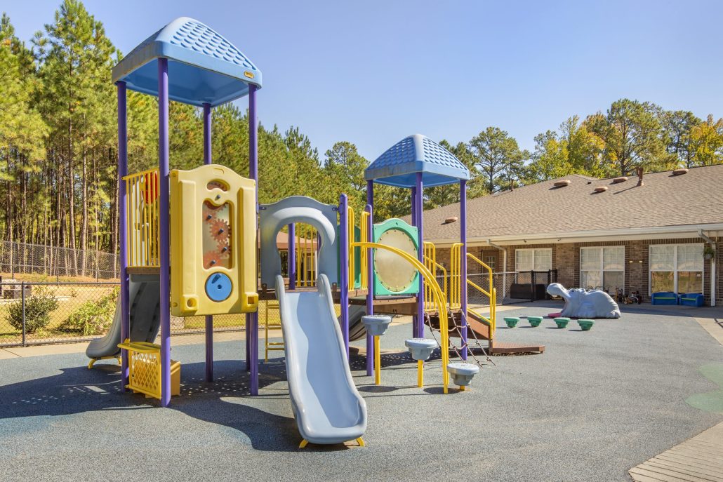 Cadence Academy Preschool Brier Creek Playground 2 Slides Jungle Gym and Other Activities Safely Enclosed In Back of Facility